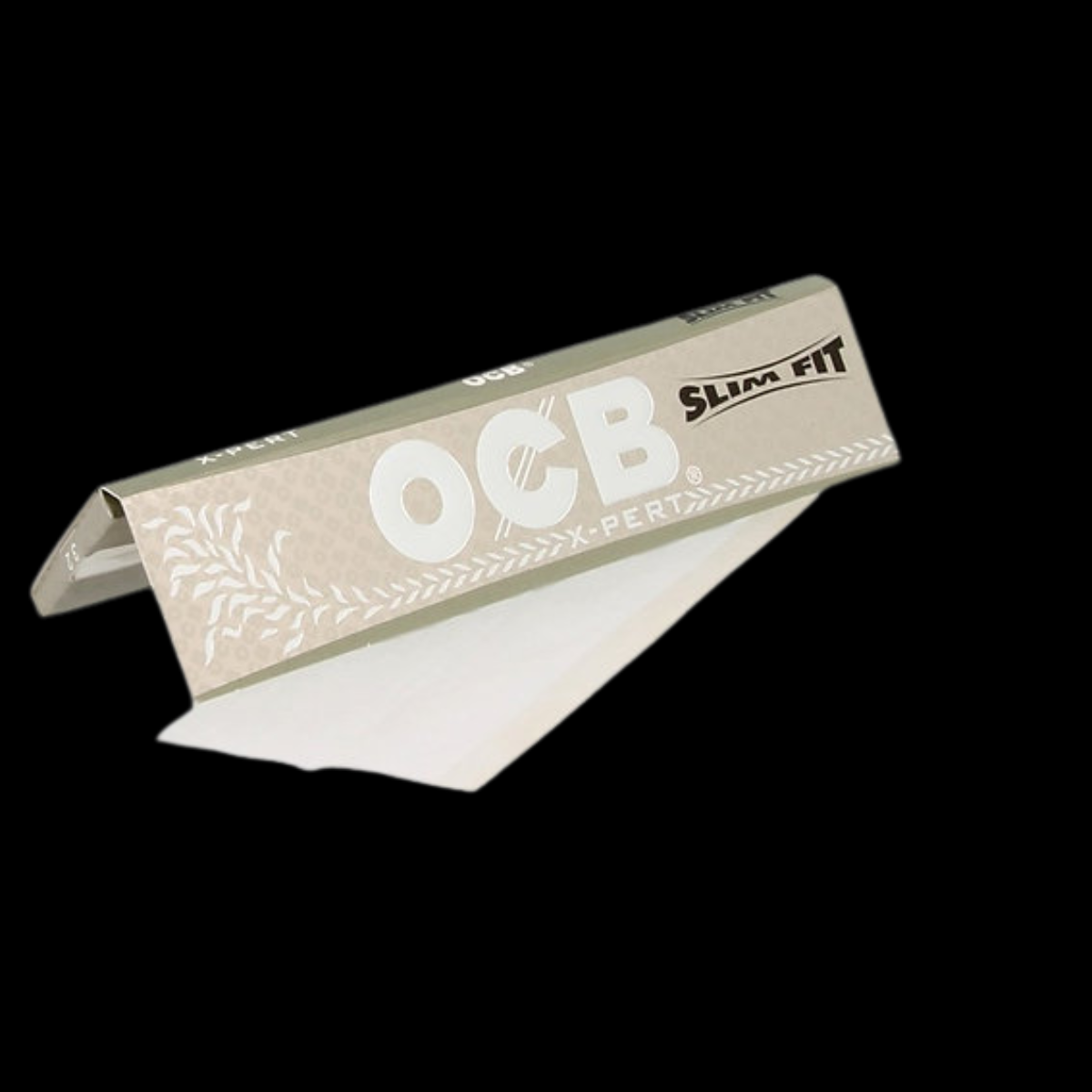 OCB X-Pert Slim Fit Edition Rolling Papers displayed on a flat surface.
